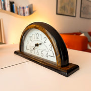 Vintage Junghans clock in faux burl wood and black, angled view