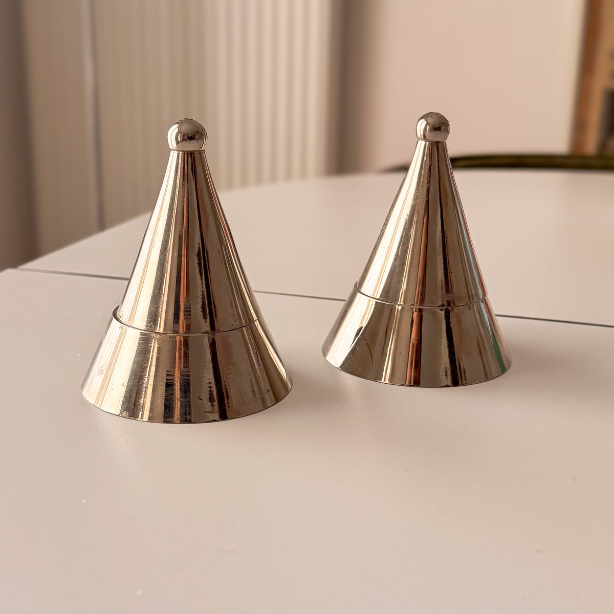 Matching pair of vintage Alessi La Conica silver tone cone tealight holders – photograph 1