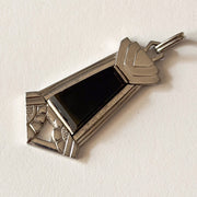 Close detail of genuine black onyx stone and Art Deco geometric metalwork