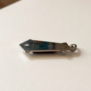Side profile of GIROR antique black onyx pendant showing depth and construction